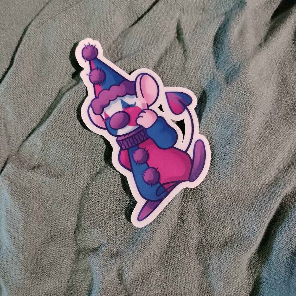 Cartoon character sticker with a purple hat and scarf on a textured gray background