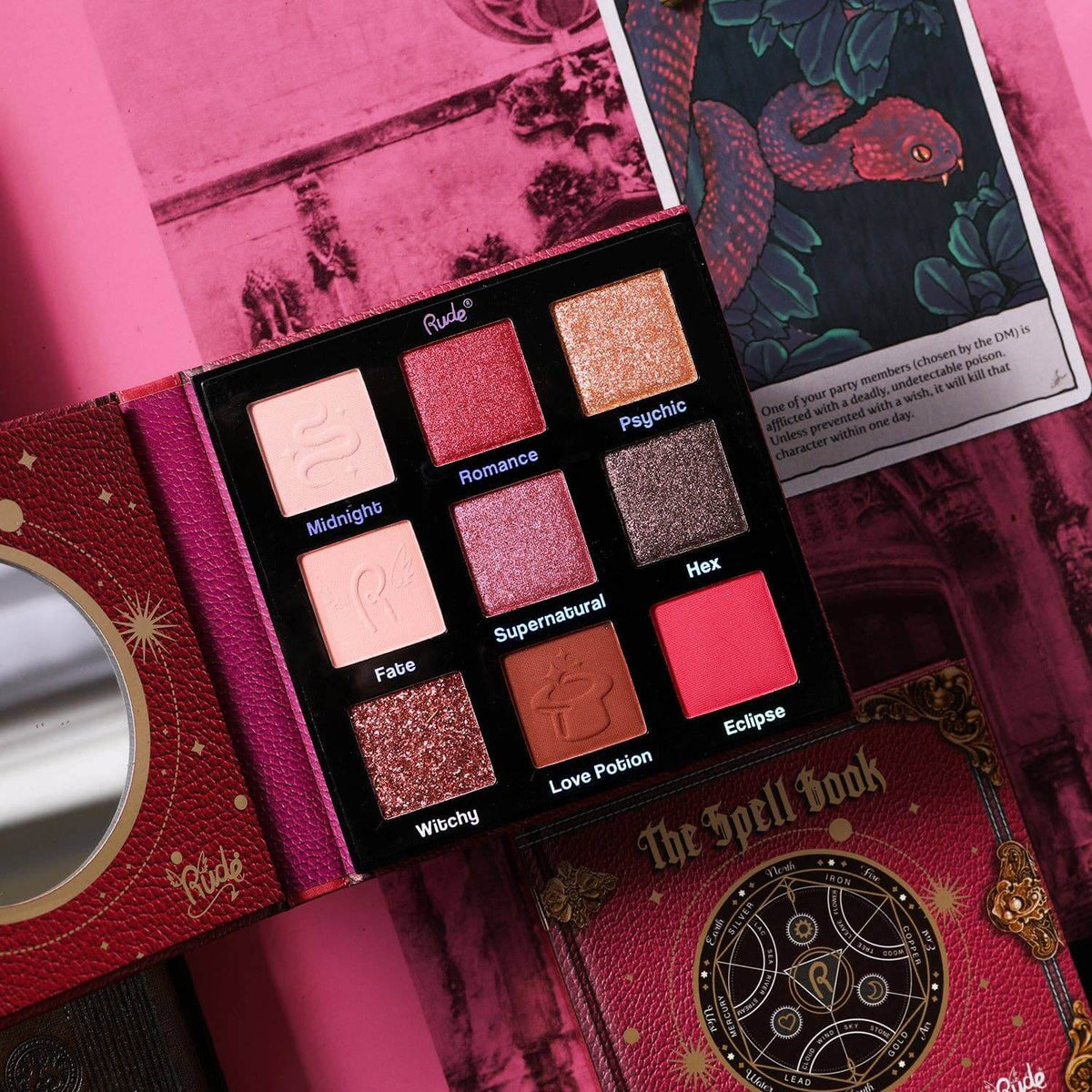Eyeshadow palette featuring shades of pink and red on a pink background.