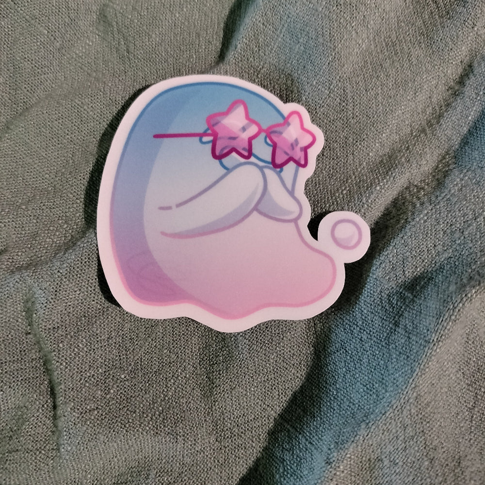Sticker of a cartoon character with star-shaped glasses on a textured fabric background