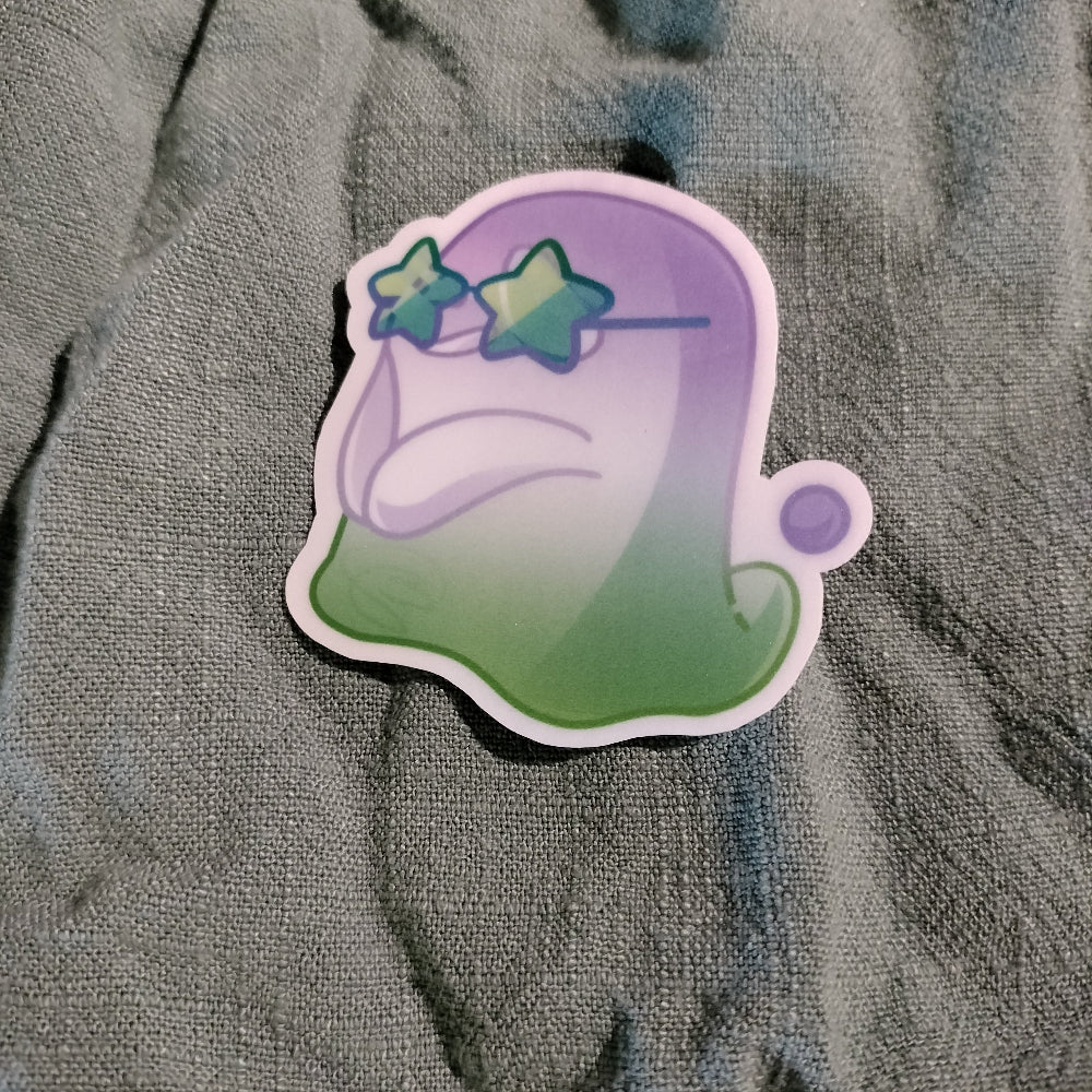 Gradient green to purple sticker with star design on a textured gray background