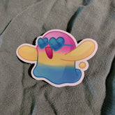Colorful cartoon character sticker with heart sunglasses on a textured gray background