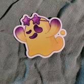 Cartoon character sticker with purple accents on a textured gray background