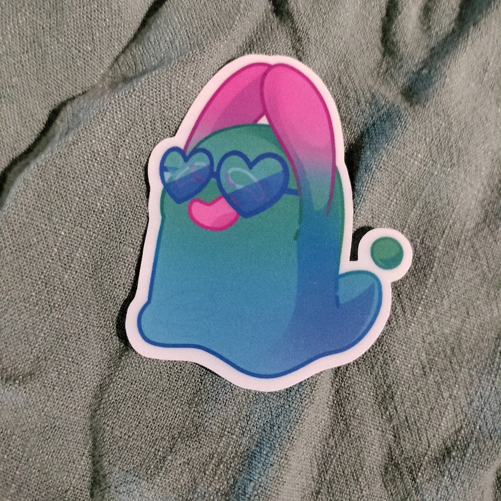 Colorful cartoon character sticker on a gray fabric background