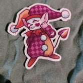Cartoon character sticker with a checkered outfit on a textured fabric background