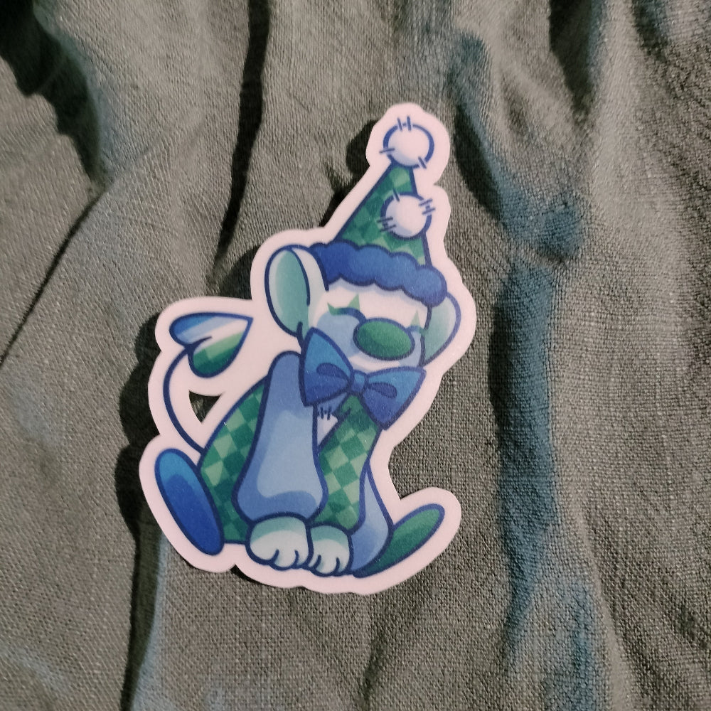Colorful cartoon character sticker on a textured fabric background
