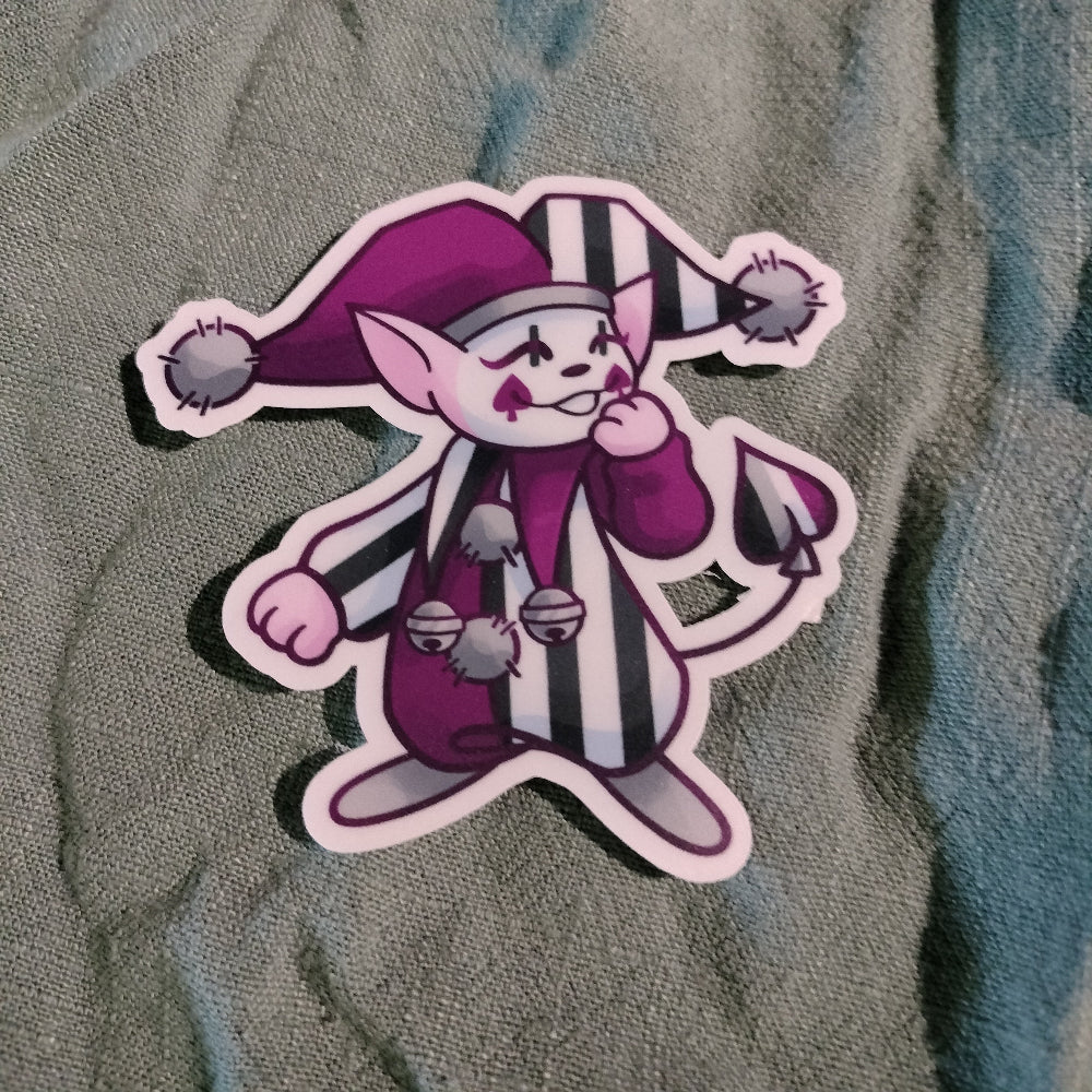 Cartoon character sticker with purple outfit and hat on a textured surface