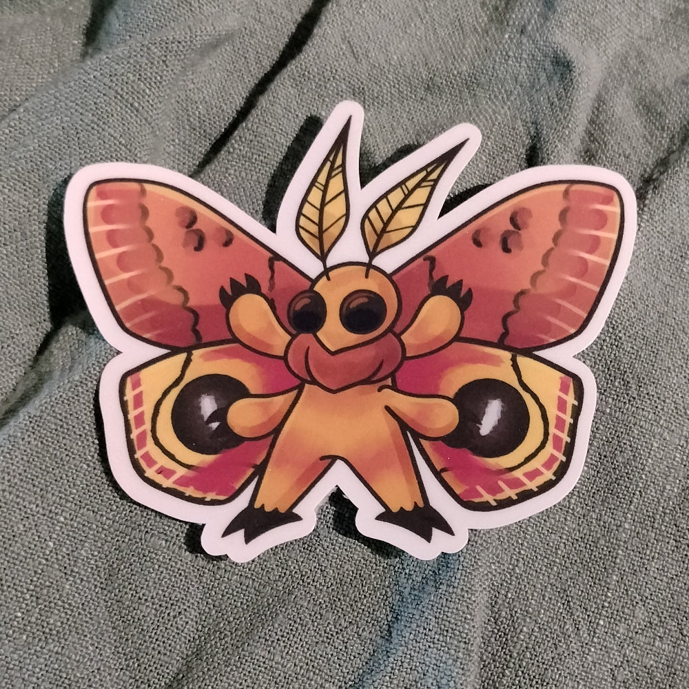 Colorful butterfly sticker on a textured fabric background