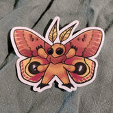Colorful butterfly sticker on a textured fabric background