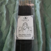 Pack of Freya Incense sticks with a label on a green fabric background
