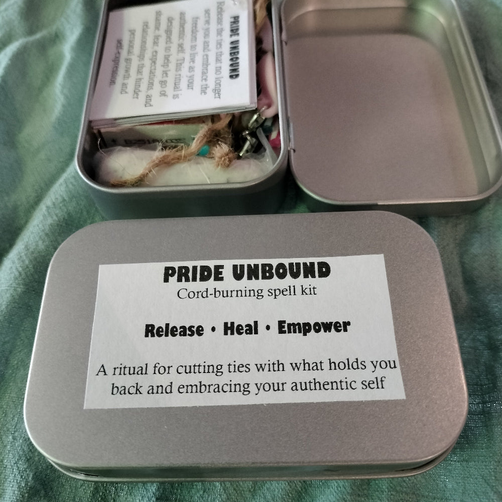 Pride Unbound spell kit with instructions on a green fabric background