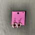 beaded playing card earrings on a pink card